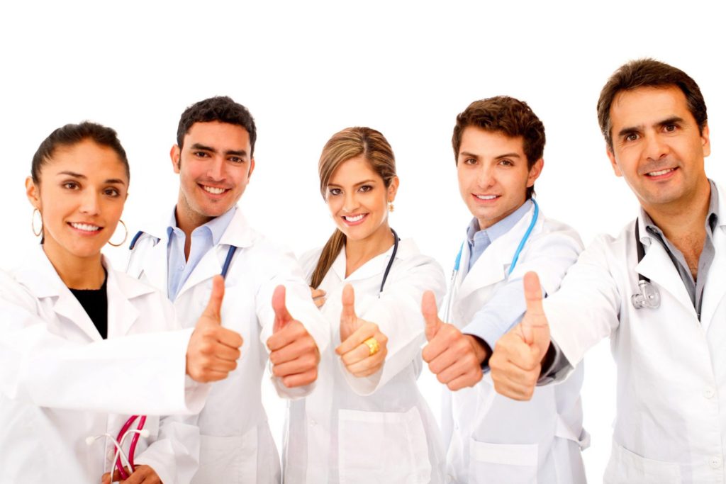 Doctors with thumbs up