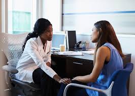 Doctor talking with patient