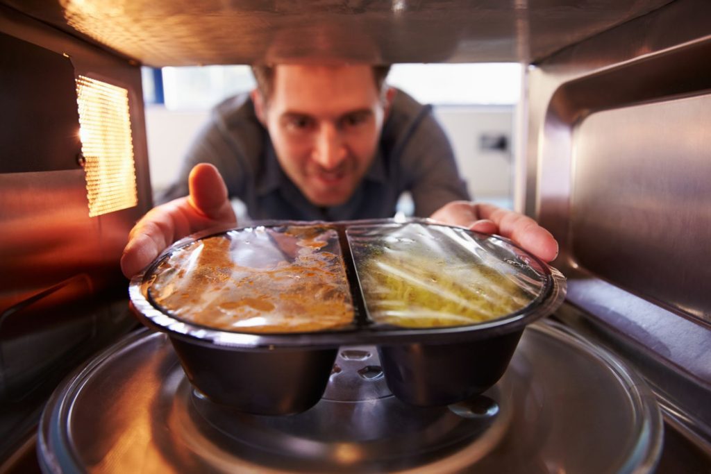 Microwaving processed food in a plastic container